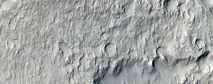 Mound Cut by Trough in Tartarus Colles Region