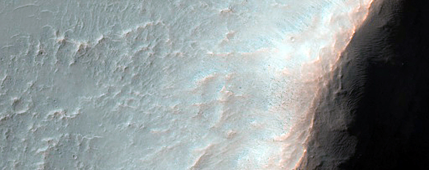Crater with Flow-Like Floor Materials
