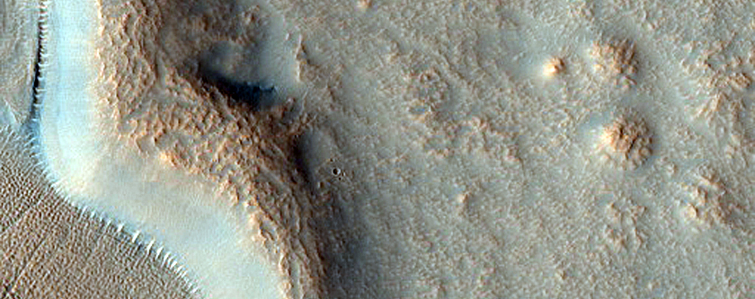 Layered Deposits in Group of Craters in Northern Mid-Latitudes