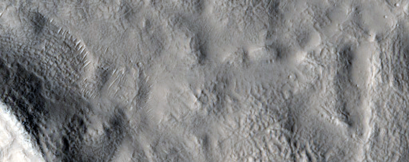 Unusual Crater Deposit in Northern Mid-Latitude Crater

