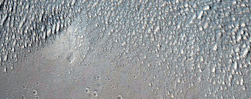 Intersecting Linear Troughs Near Wall of Ius Chasma
