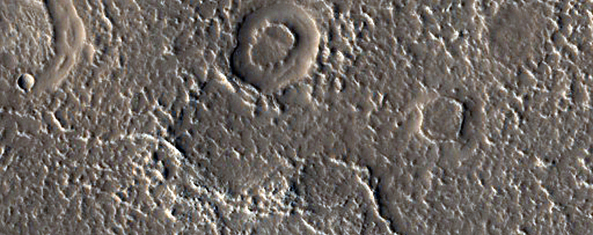 Channel and Infilled Crater Near Quenisset Crater
