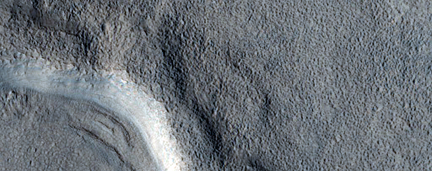Dipping Layers in Crater in Deuteronilus Mensae
