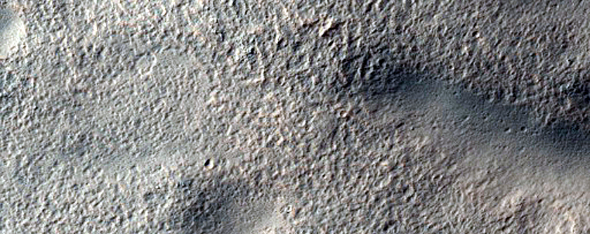 Layered Features in Craters in Hellas Montes Region
