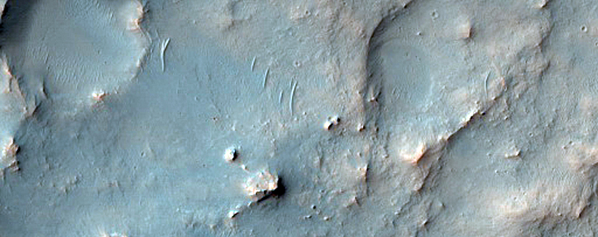 Possible Phyllosilicates in Eroded Terrain Near Channel
