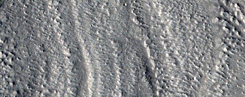 Layers in Trough Wall in Coloe Fossae Terrain
