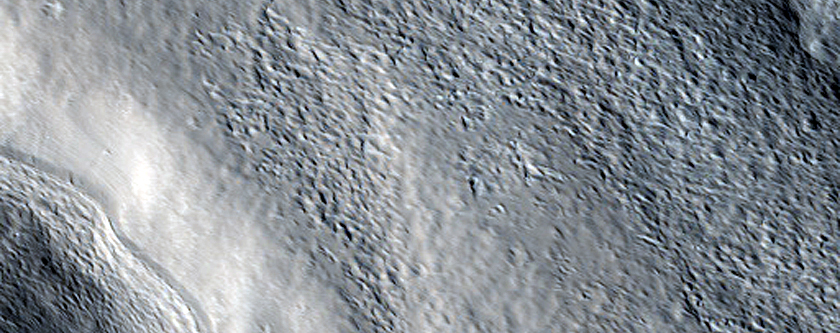 Crater and Channels in Acheron Fossae Region
