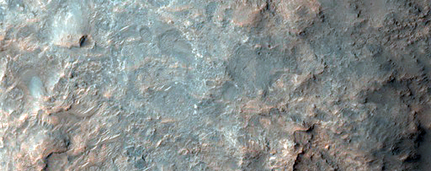 Layered Bedrock Exposure in Impact Crater
