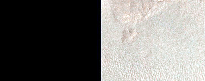 Exposed Fractured Bedrock in Central Uplift of Crater Near Valles Marineris
