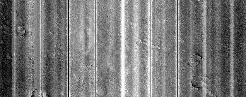 Layered Feature in Crater in Galaxias Fossae
