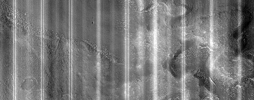 Dipping Layers in Ismenius Fossae
