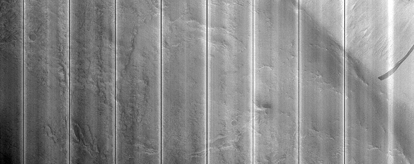 Curved Ridges along a Trough Wall in Acheron Fossae
