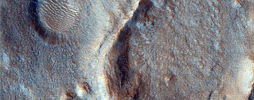 Dipping Layers and Funnel Crater in Deuteronilus Mensae
