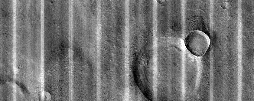 Dipping Layers in Crater in Northern Mid-Latitudes
