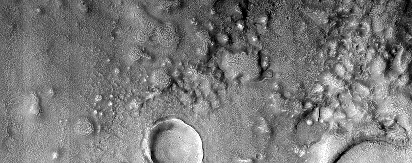 Layered Features in Craters in Northern Mid-Latitudes
