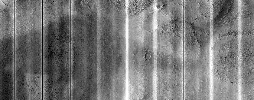 Dipping Layers Against Mounds in Northern Plains
