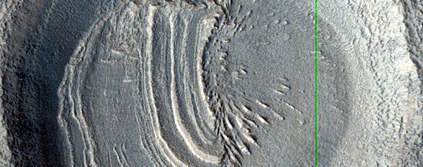 Layered Deposit in Crater in Northern Mid-Latitudes
