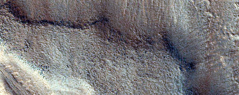 Dipping Layers Against Mound in Northern Mid-Latitudes
