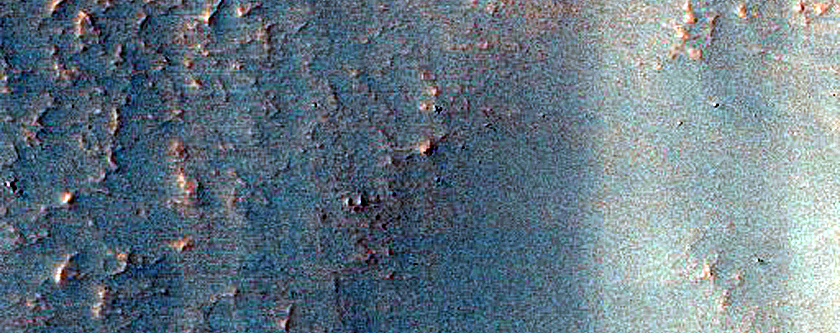Layers in Mantle along Wall of Southern Mid-Latitude Crater 
