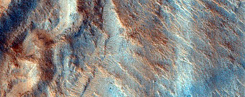 Crater with Layered Ejecta and Possible Faulting
