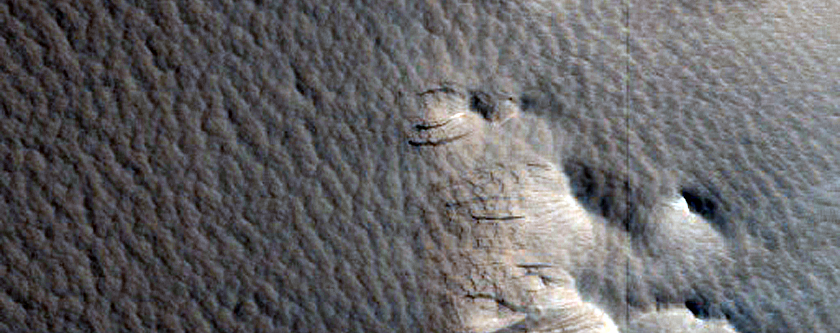 Impact Crater with Layered Ejecta Near Biblis Patera
