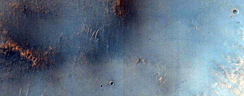 Small Valley on Margin of 4-Kilometer Diameter Crater
