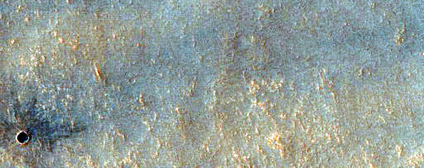 Well-Preserved Crater and Wrinkle Ridge
