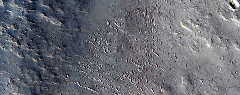 Valley Cutting Crater Rim North of Amenthes Rupes
