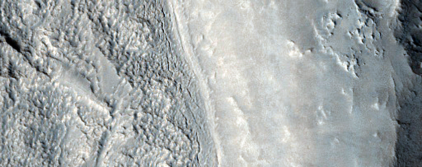 Narrow Fractures Near Crater Ejecta
