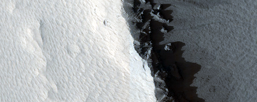 Crater with Fluidized Ejecta West of Arsia Mons
