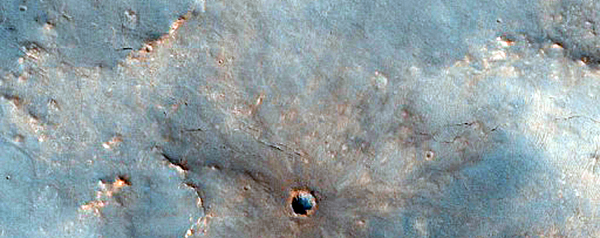 Crater on Syrtis Major Region Flow Boundary
