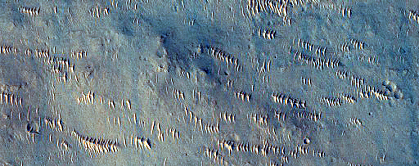 Fresh 1 to 2 Kilometer Impact Crater with Rocky Ejecta
