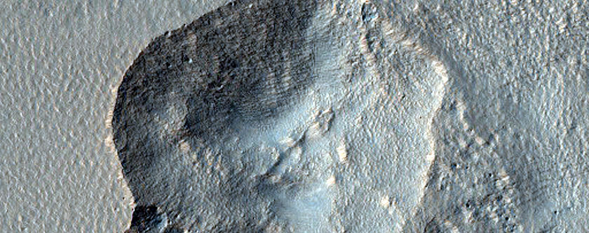 Pit in Mid-Latitude Mantle
