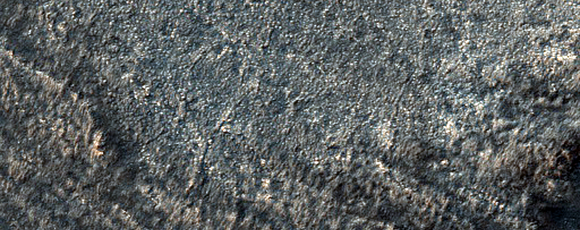 Circular and Banded Landforms in CTX B08_012852_0994_XN_80S139W
