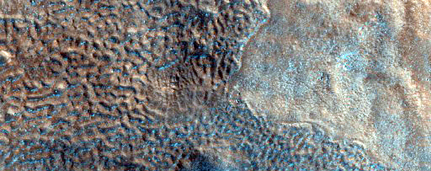 Small Pits in Crater Ejecta in Northern Arabia Terra
