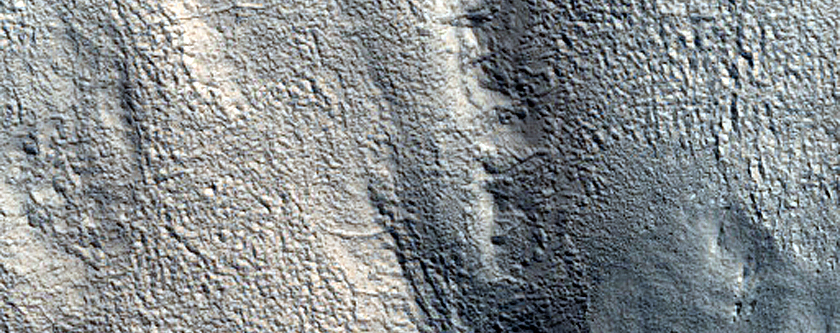 Channels on Edge of Northern Mid-Latitude Crater Ejecta
