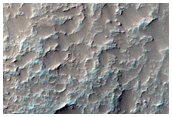 Antiquus et maxime erosus ictu effectus crater in Eo Chasmate