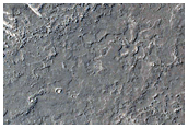 מקור פוטנציאלי לערוצים קטנים לאורך תלמים צרברוס פוסאי (Cerberus Fossae)
