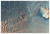 Small Well-Preserved and Potentially Gullied Crater in Idaeus Fossae
