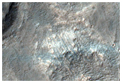 Pitted Cone Crosscut by Wrinkle Ridge in Aurorae Chaos
