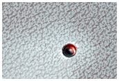 Small Ice-Filled Crater on North Polar Layered Deposits
