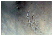 Layers on Crater Rim Near Denning Crater
