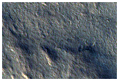 Head of Small Chasmata on Edge of Layered Deposits
