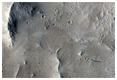 Crater with Central Peak Northeast of Olympus Mons
