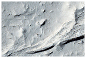 Dark Sediments Interspersed with Sinuous Ridges in Medusae Fossae Formation
