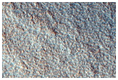 Possible Olivine in Ejecta of Northern Plains Crater
