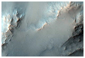 Impact Crater Exposing Bedrock
