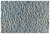 Layered Materials Around Impact Crater
