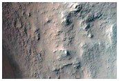 Exposure of Light-Toned Layering along Capri Chasma Wallrock
