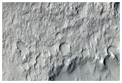 Mound Cut by Trough in Tartarus Colles Region